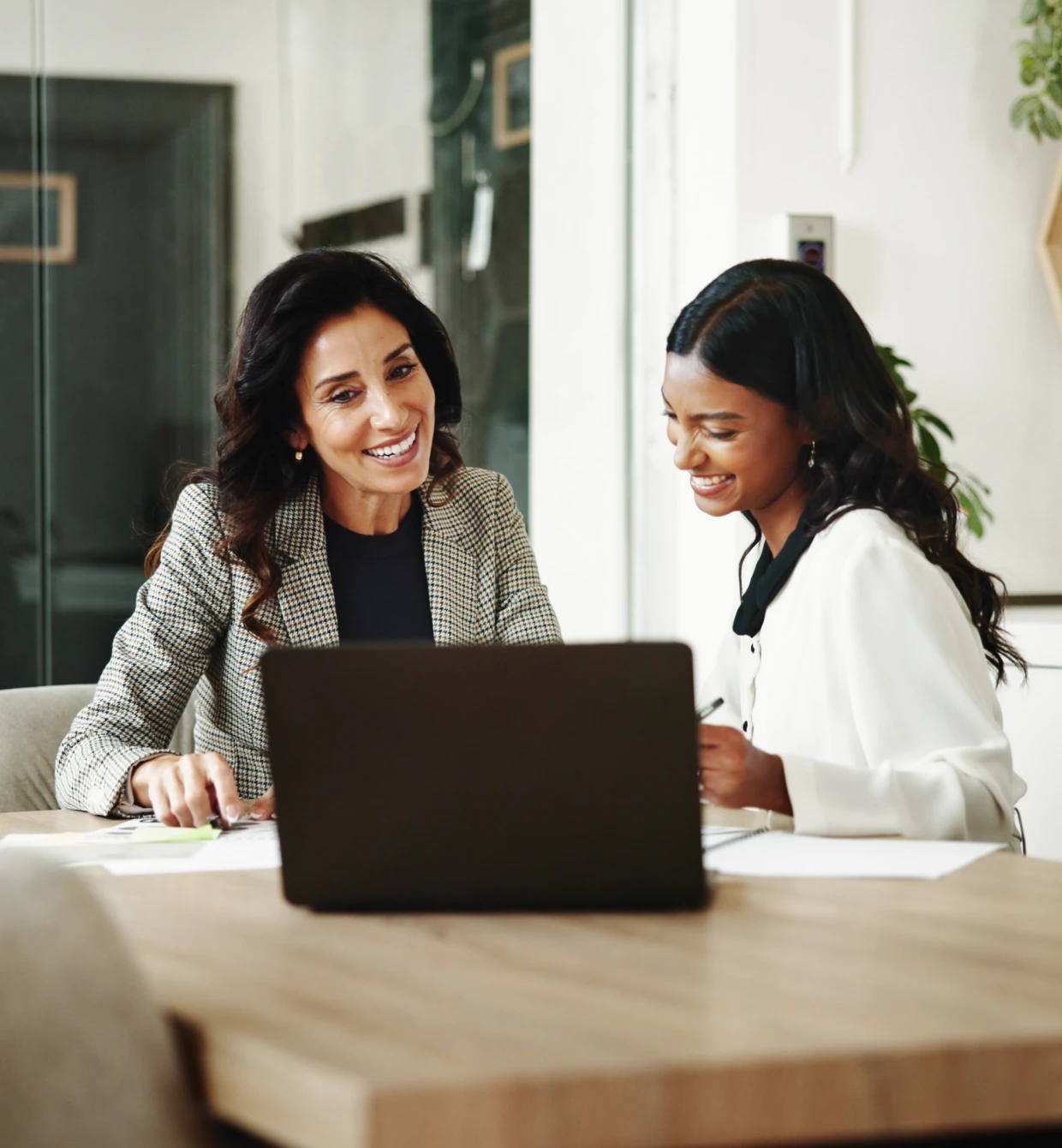 Business meeting with two women smiling