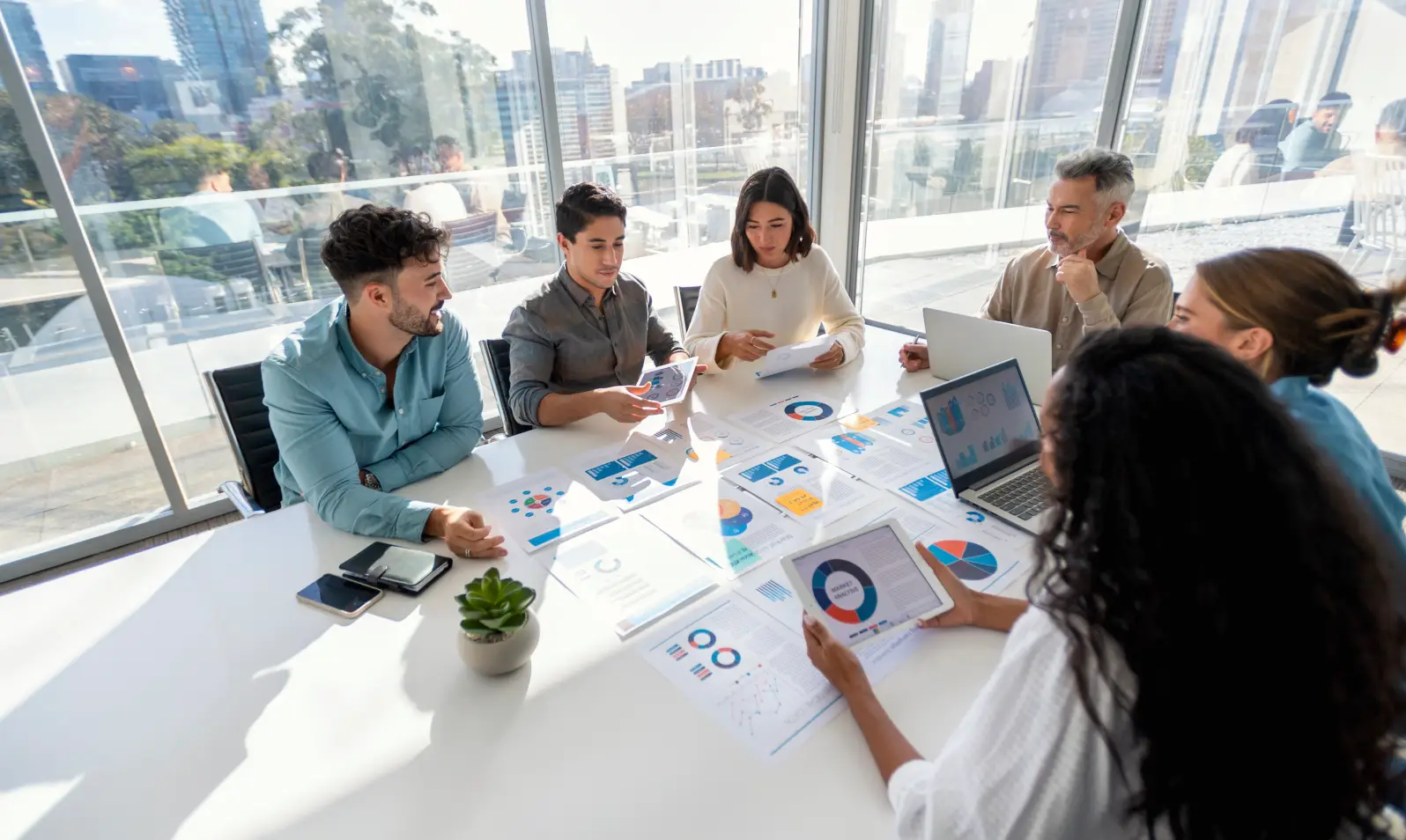 Team discussing charts in a meeting